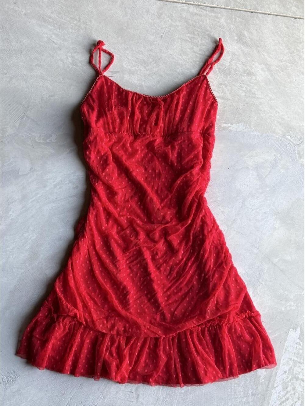 Red polka dot mini dress with ruffles and adjustable straps